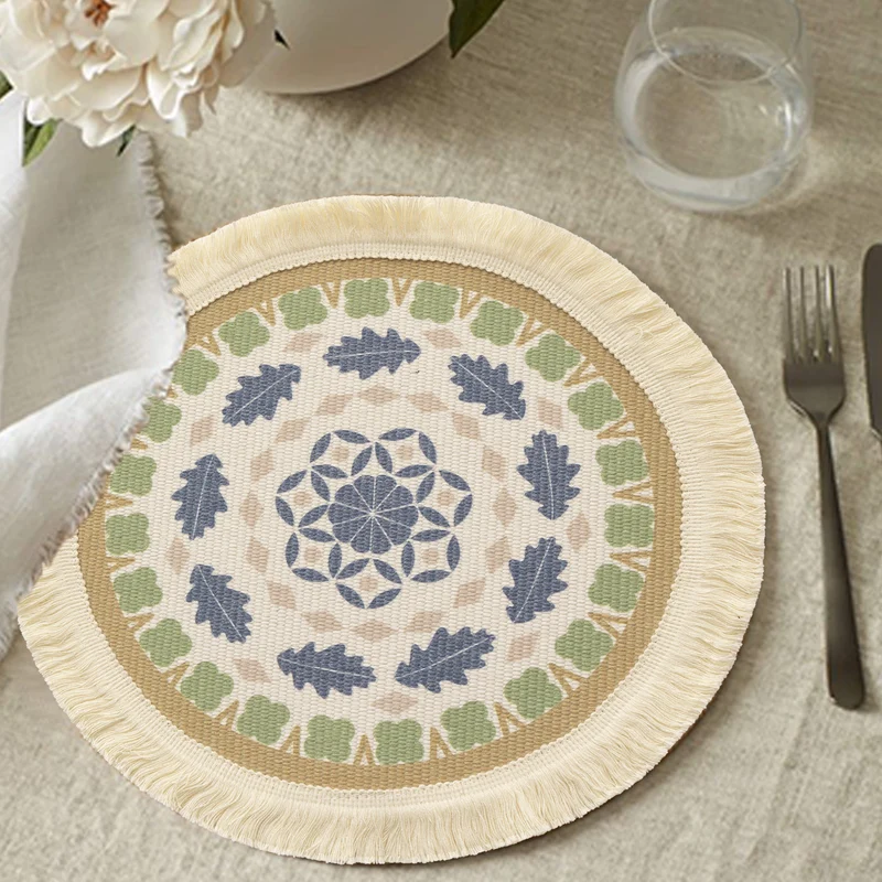 Round handmade woven decorative rug with fringes and botanical pattern Stornfield