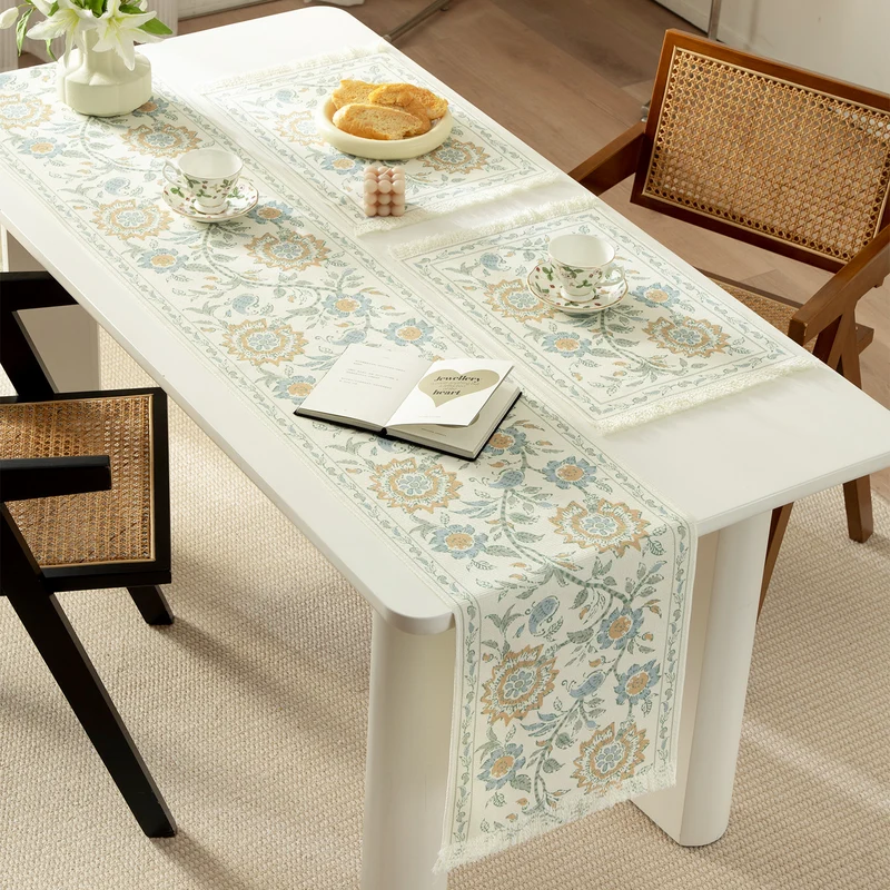Round handmade woven decorative rug with fringes and botanical pattern Stornfield