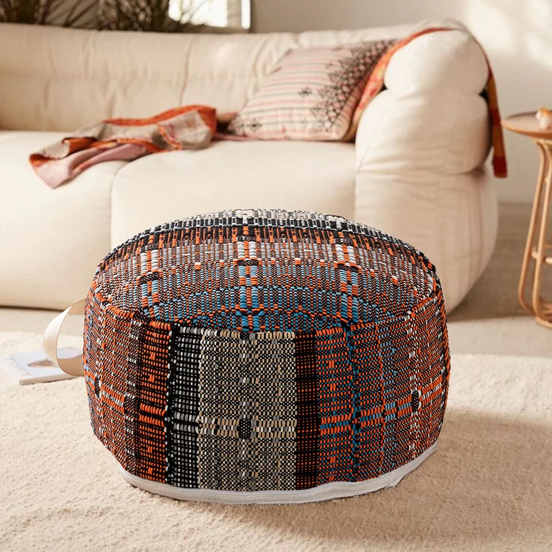 Round woven seat pouf made of durable cotton mix with practical carrying handle Stornfield