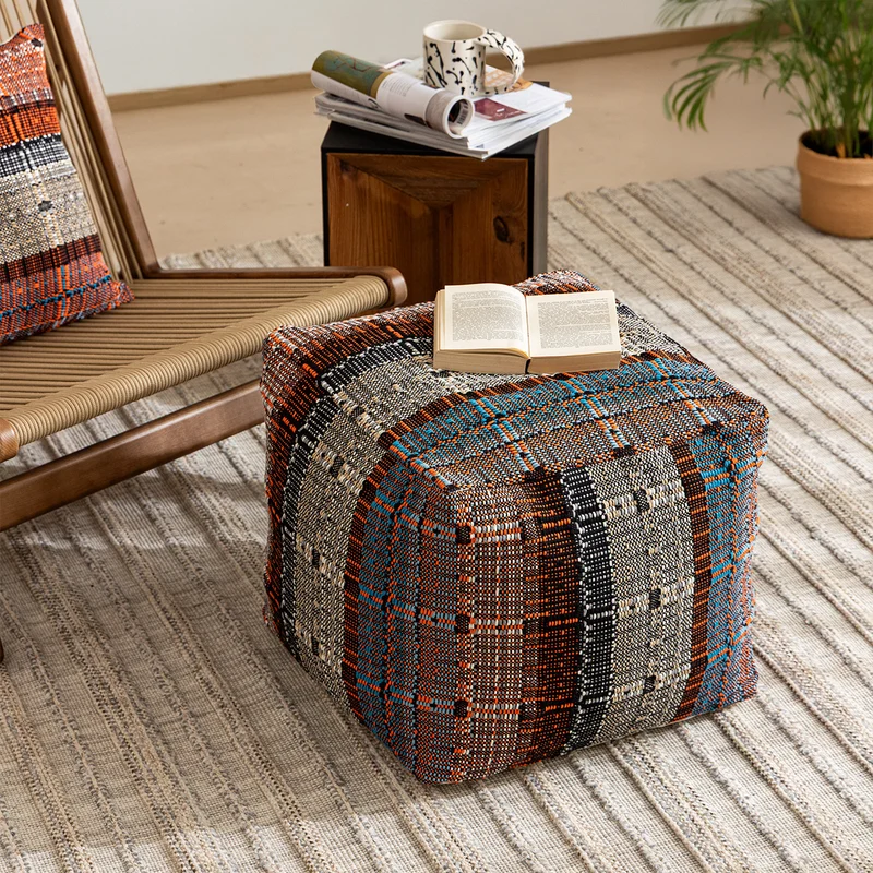 Round woven seat pouf made of durable cotton mix with practical carrying handle Stornfield