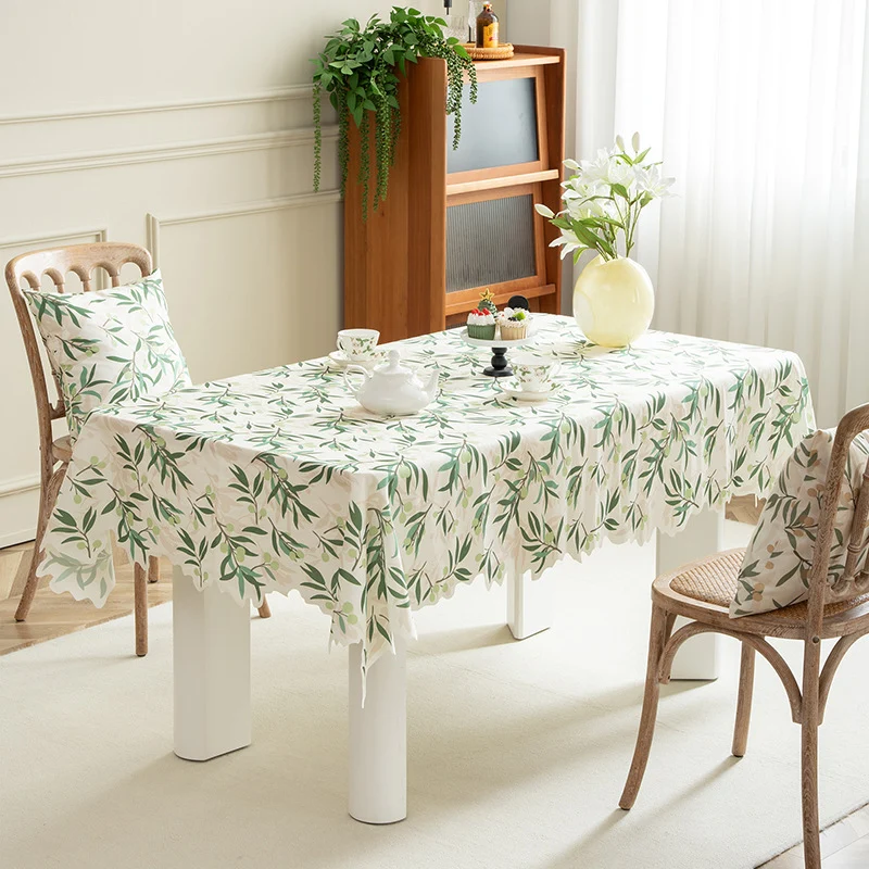 Round wipeable tablecloth with floral cut-out hem Stornfield