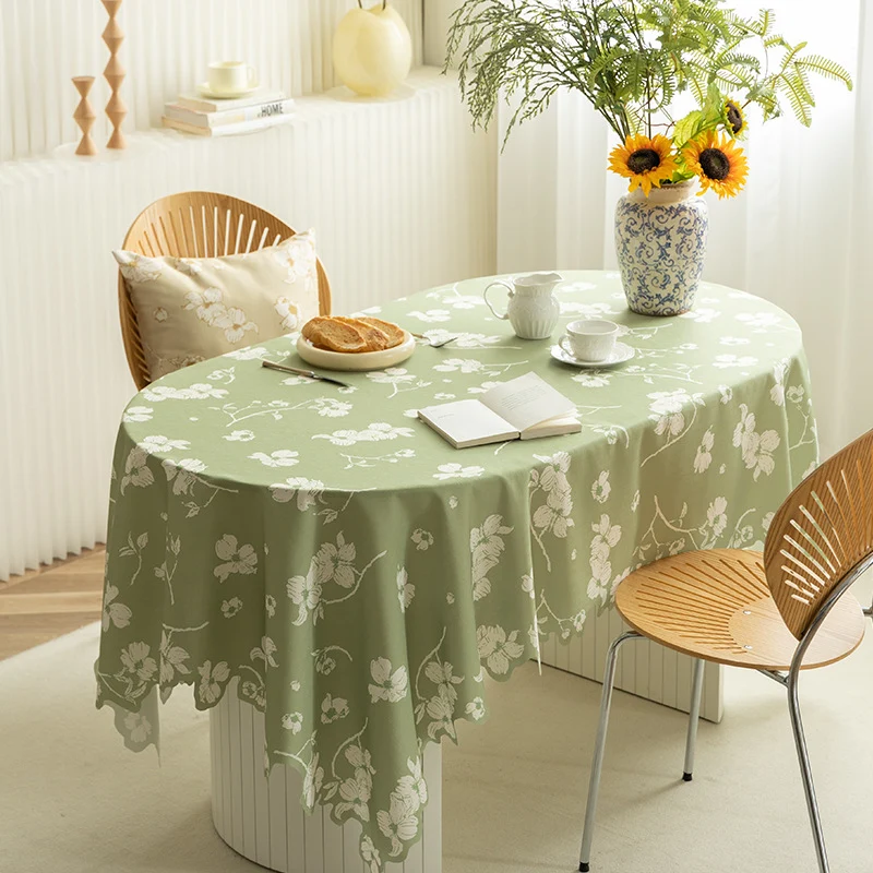Round wipeable tablecloth with floral cut-out hem Stornfield