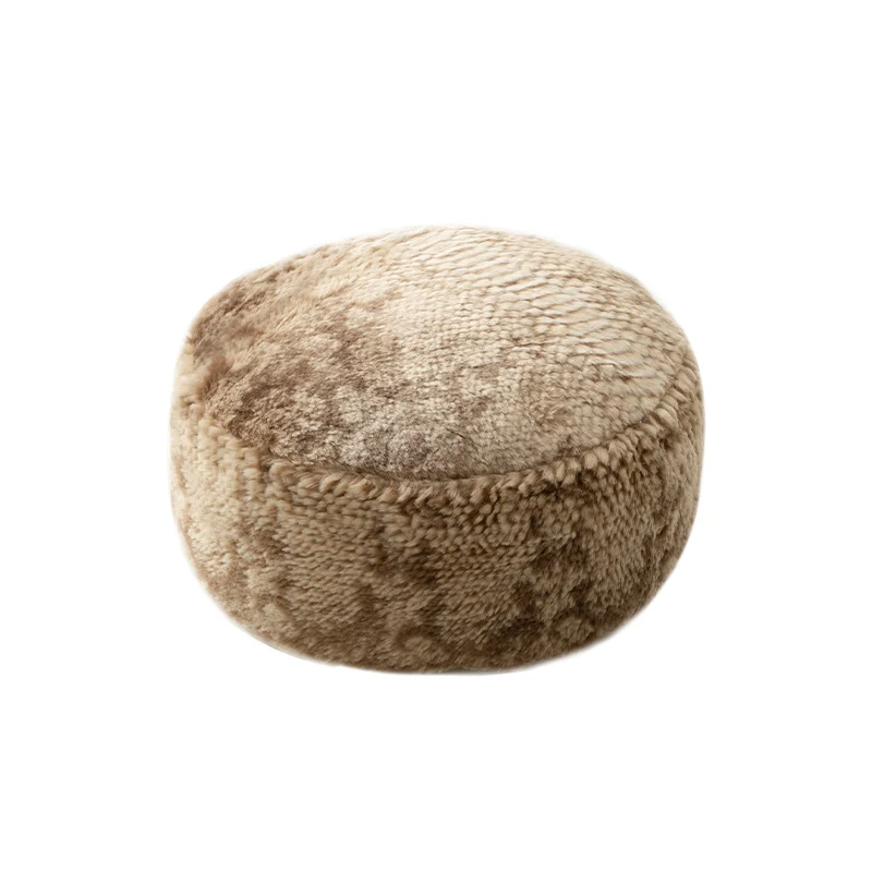 Round seat pouf made of synthetic fur with soft padding and removable cover Stornfield