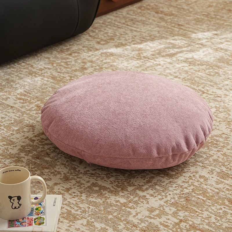 Round floor seat pouf made of teddy plush with a shape-retaining padded core Stornfield
