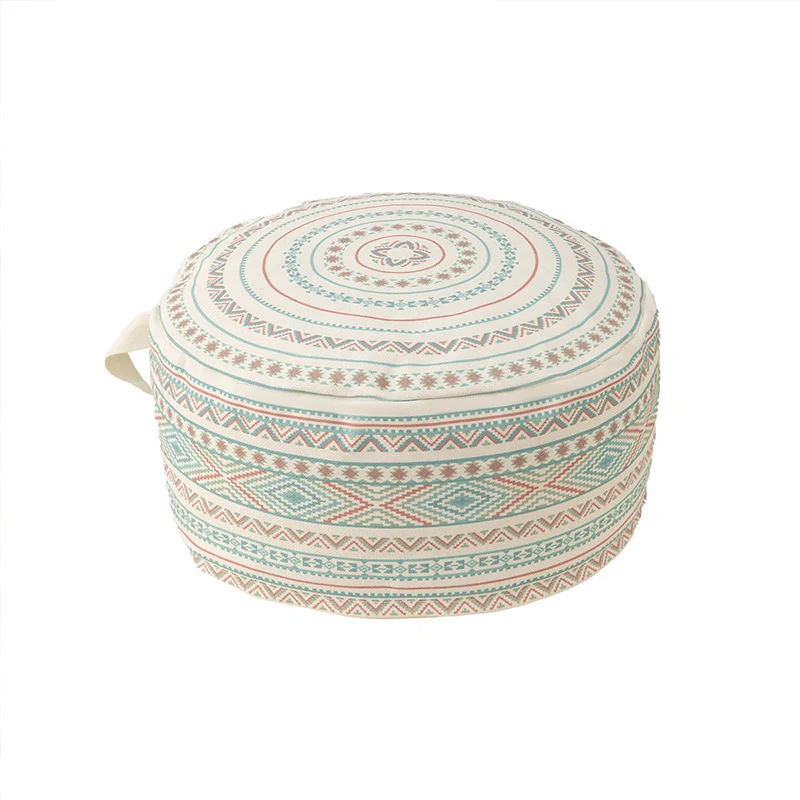 Round floor pouf with ethnic weaving pattern and practical carrying handle Stornfield