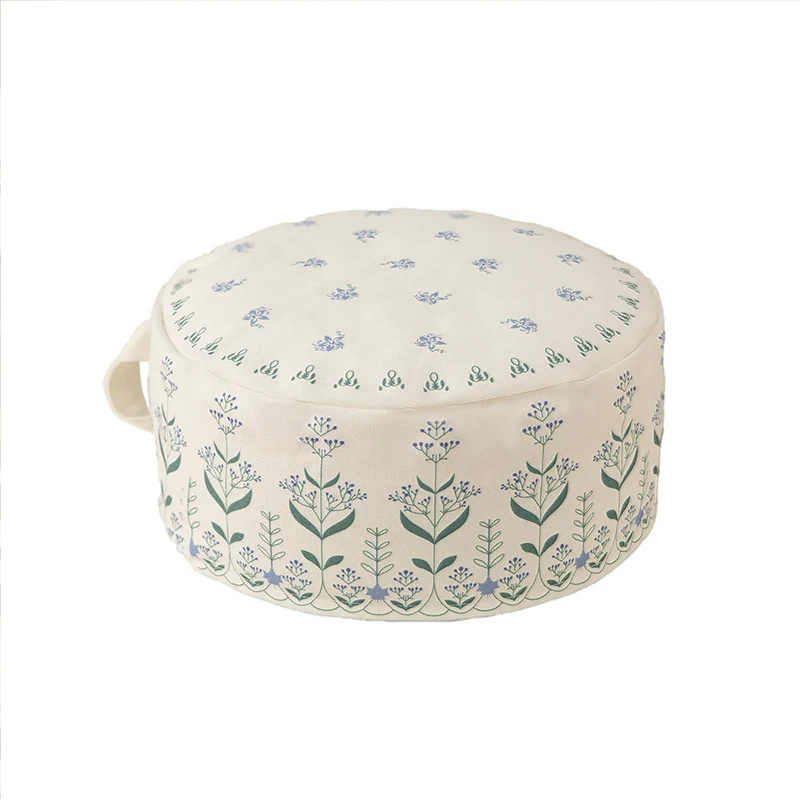 Round floor pouf with ethnic weaving pattern and practical carrying handle Stornfield