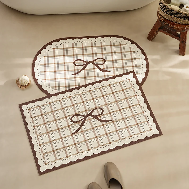 Rectangular wipeable placemat with checked pattern, wavy decorative edge and bow motif Stornfield