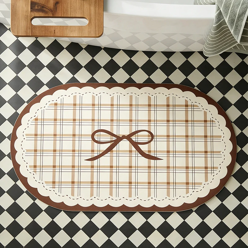 Rectangular wipeable placemat with checked pattern, wavy decorative edge and bow motif Stornfield
