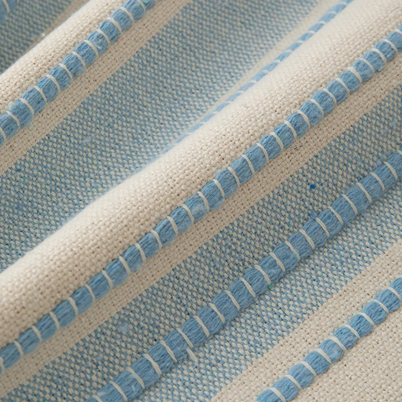 Square cushion cover made of hand-woven cotton blend with decorative fringe trim Stornfield