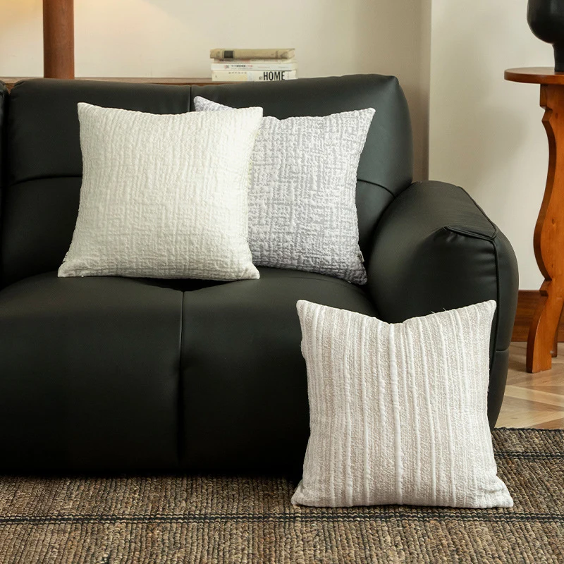 Square, quilted decorative pillow with woven texture Stornfield
