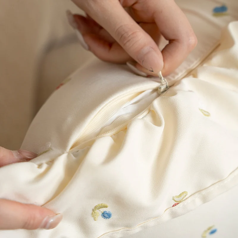 Square embroidered cushion cover made of cotton blend with frill edge Stornfield
