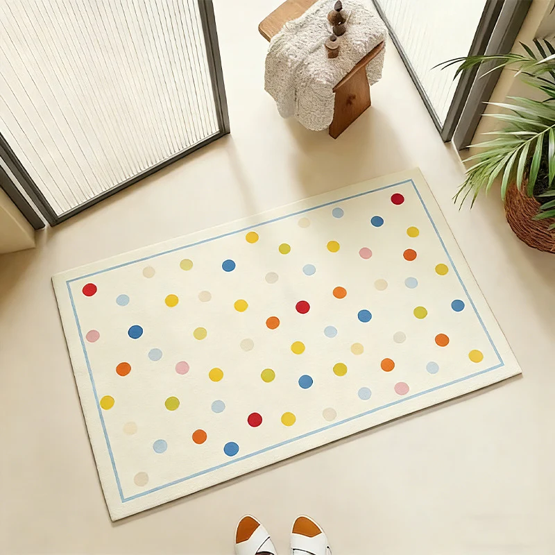 Oval wipeable placemat with pastel-colored polka dots Stornfield