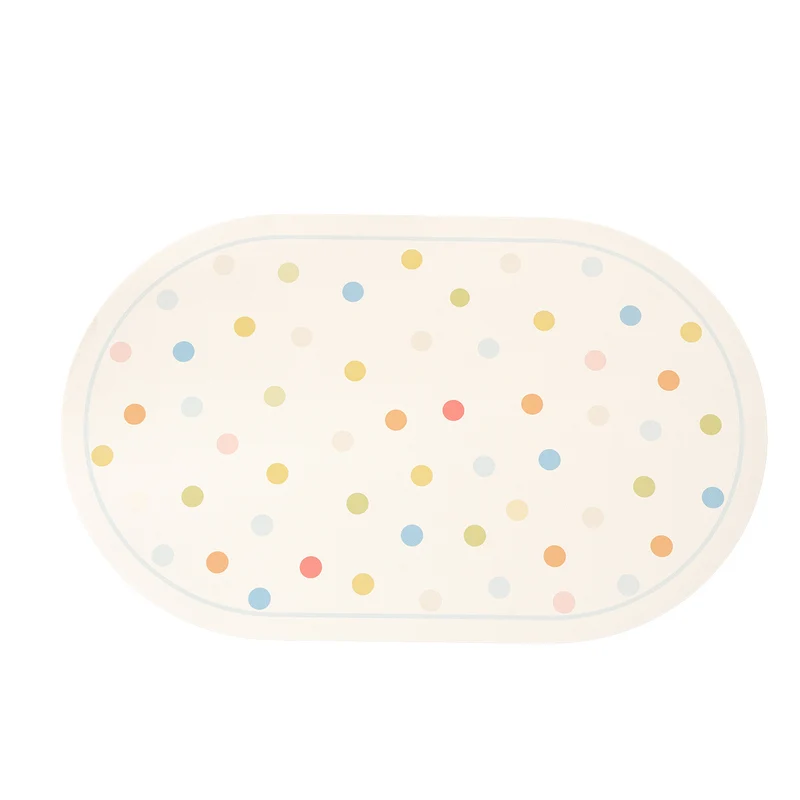 Oval wipeable placemat with pastel-colored polka dots Stornfield