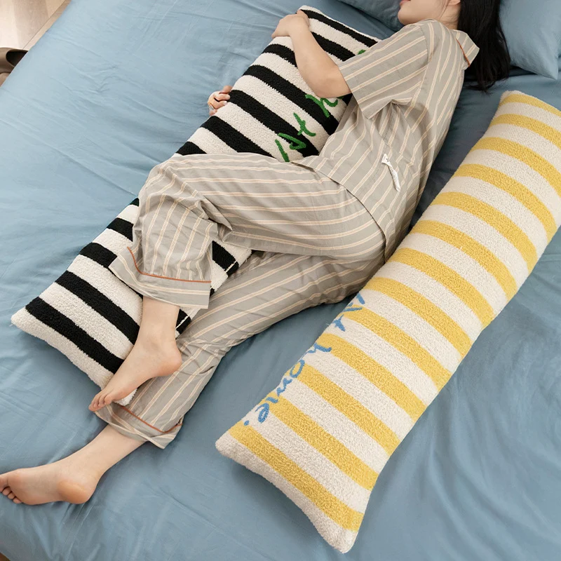 Elongated bench and windowsill cushion with nautical stripe texture and embroidered lettering Stornfield