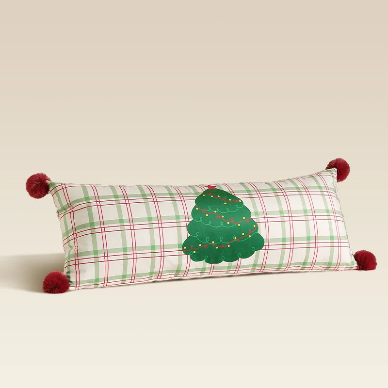 Long decorative lumbar and neck pillow in Christmas check with pompom and dog-tree motif Stornfield