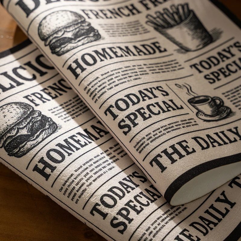 Coir doormat in newspaper layout with non-slip backing Stornfield