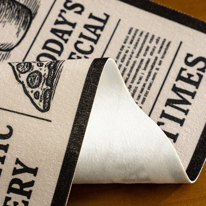 Coir doormat in newspaper layout with non-slip backing Stornfield