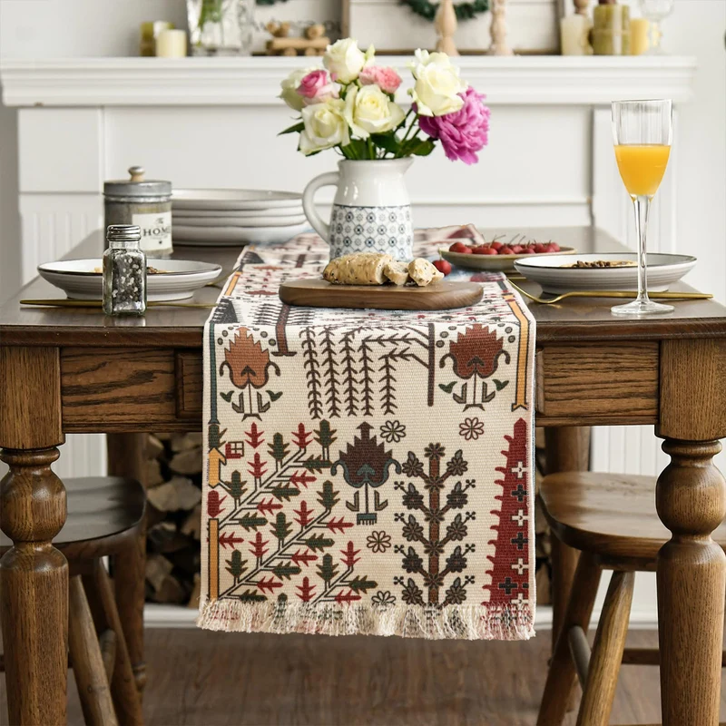 Jacquard table runner with floral vine structure and decorative fringes Stornfield