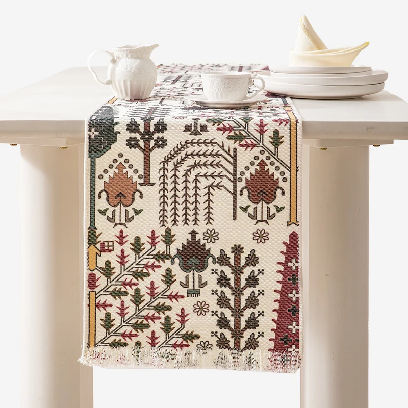 Jacquard table runner with floral vine structure and decorative fringes Stornfield