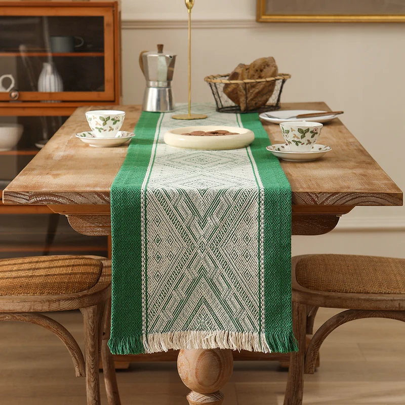 Woven table runner with geometric ethnic ornament and fringes Stornfield