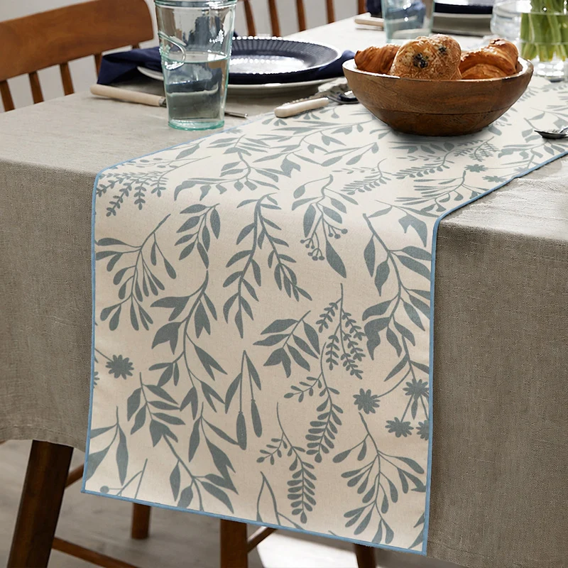 Woven table runner in botanical leaf pattern made of cotton blend Stornfield