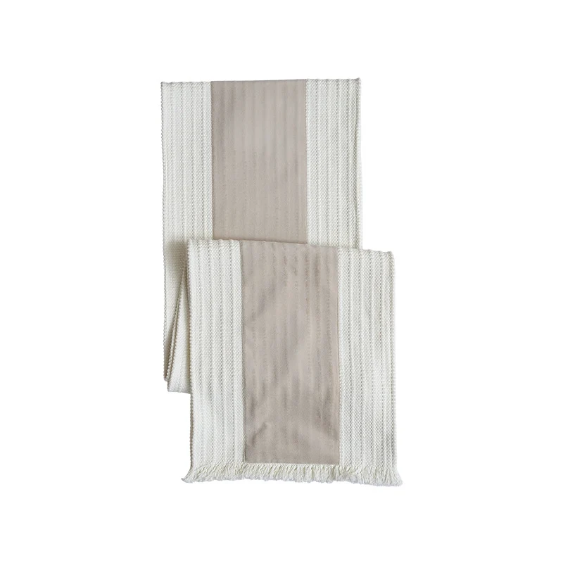 Woven table runner made of cotton blend with textured waffle weave and contrasting center strip Stornfield