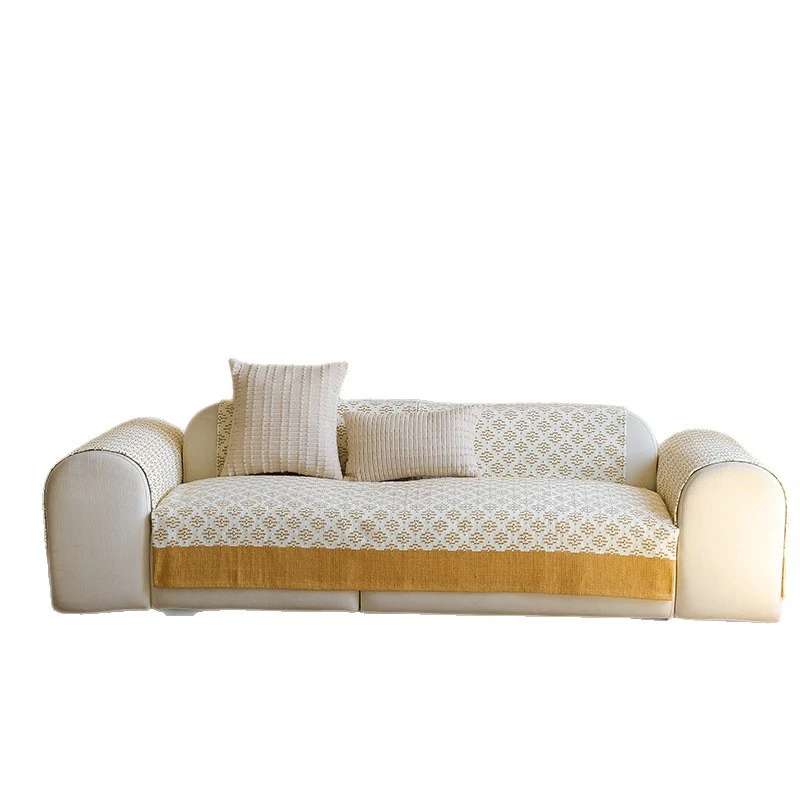 Knitted sofa cover with jacquard pattern and reinforced hem border Stornfield