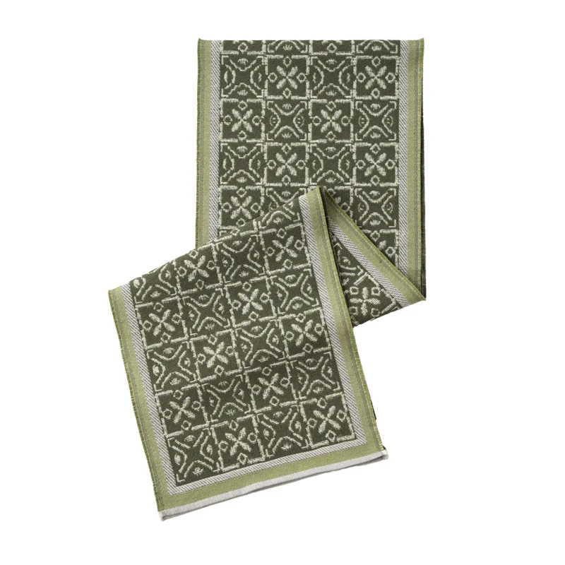 Decorative table runner with woven ornament jacquard and finely hemmed edges Stornfield