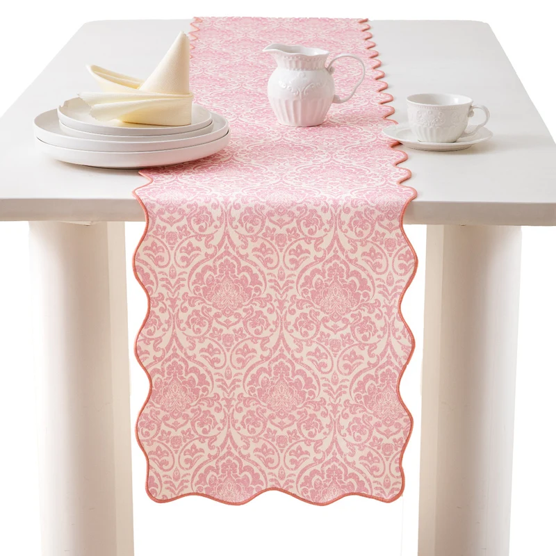 Damask-style table runner with curved wave edge and fine ornamental print Stornfield