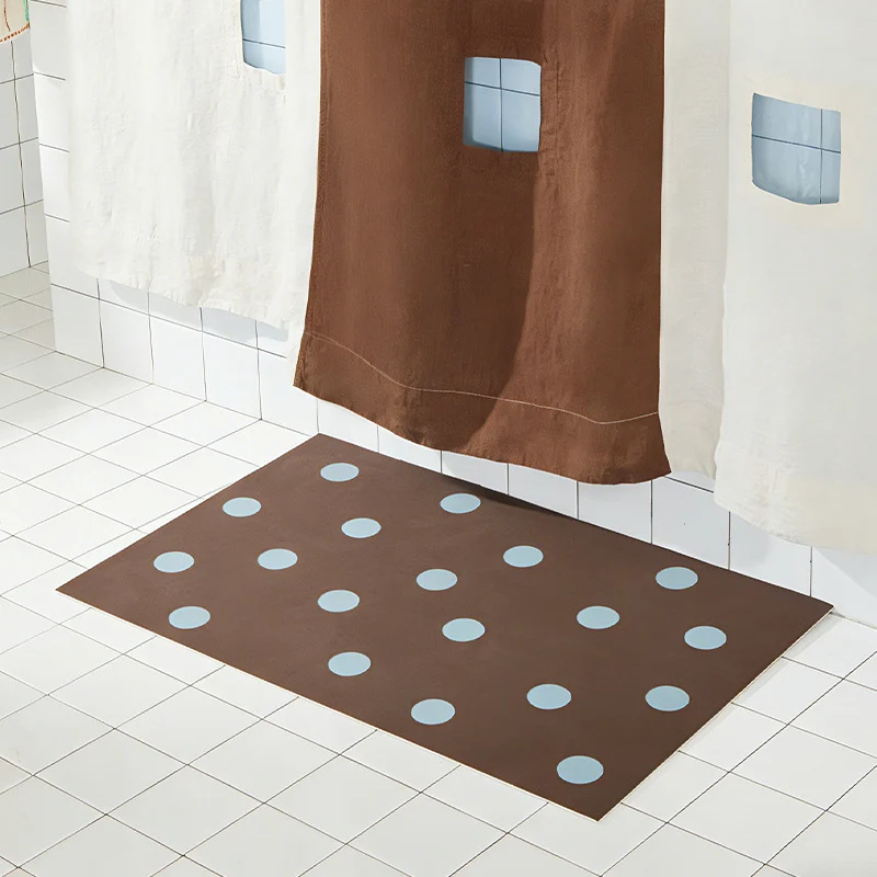 Wipeable placemat made of PVC with large polka dot pattern and non-slip backing Stornfield