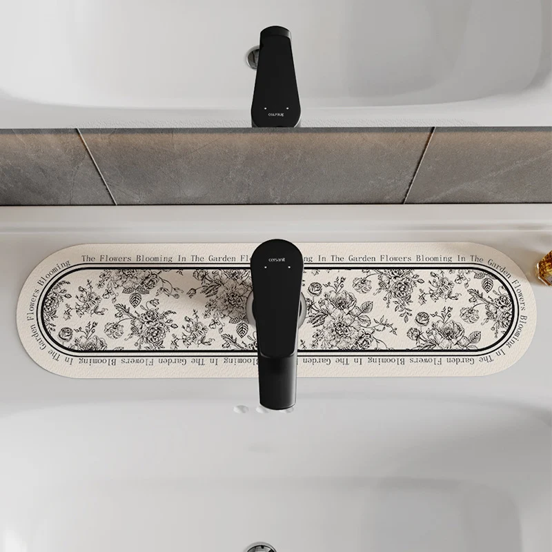 Decorative Oval Silicone Faucet Splash Guard Mat with Floral Engraved Print and Non-Slip Backing