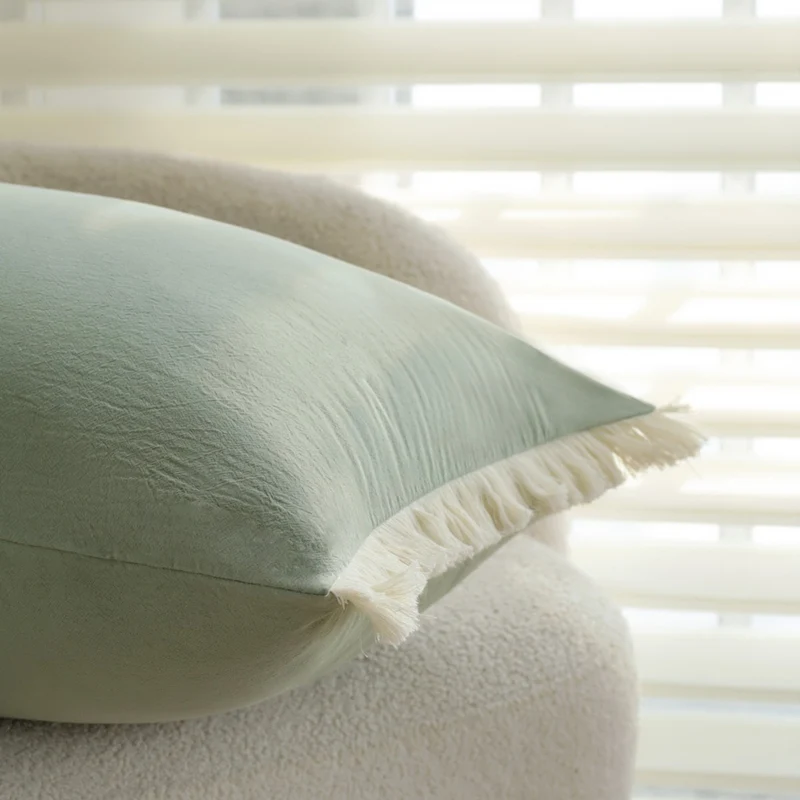 Rectangular decorative cushion cover with subtle fringes and soft cotton-linen look Stornfield