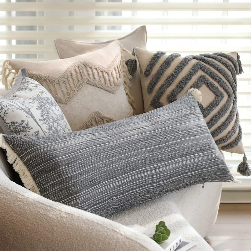 Rectangular linen look lumbar pillowcase with fine striped texture and tassels Stornfield