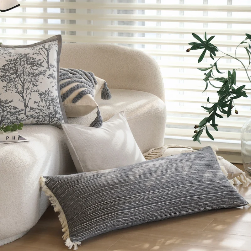 Rectangular linen look lumbar pillowcase with fine striped texture and tassels Stornfield