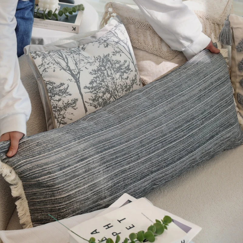 Rectangular linen look lumbar pillowcase with fine striped texture and tassels Stornfield
