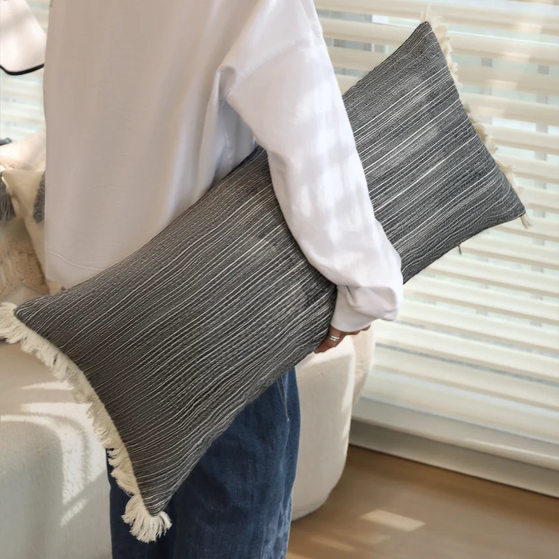 Rectangular linen look lumbar pillowcase with fine striped texture and tassels Stornfield