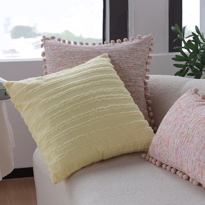 Rectangular decorative pillowcase with mottled chenille structure and pompom trim Stornfield