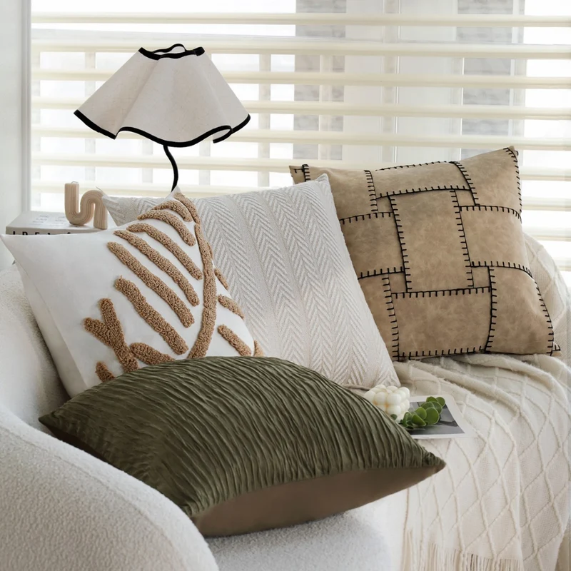 Square decorative cushion cover with tactile herringbone tufting made of cotton blend Stornfield