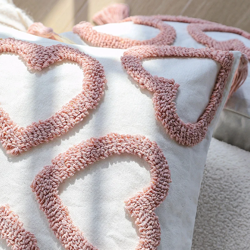 Square decorative cushion cover with hand-tufted heart reliefs and decorative tassels Stornfield