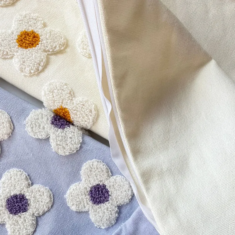 Square decorative cushion cover with hand-tufted flower relief and bouclé applications Stornfield