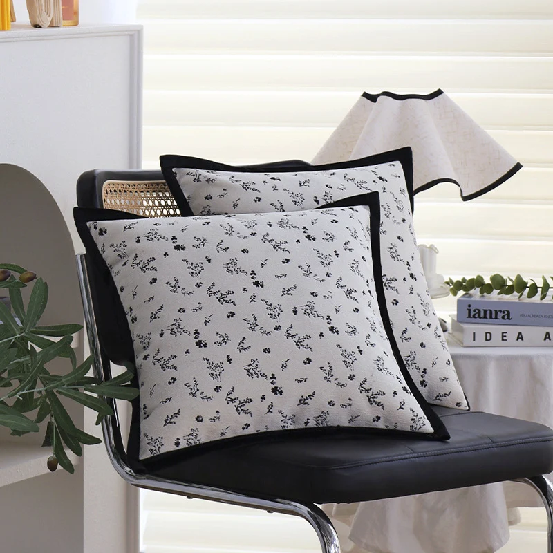 Square decorative cushion cover with subtle floral jacquard texture and elegant piping Stornfield