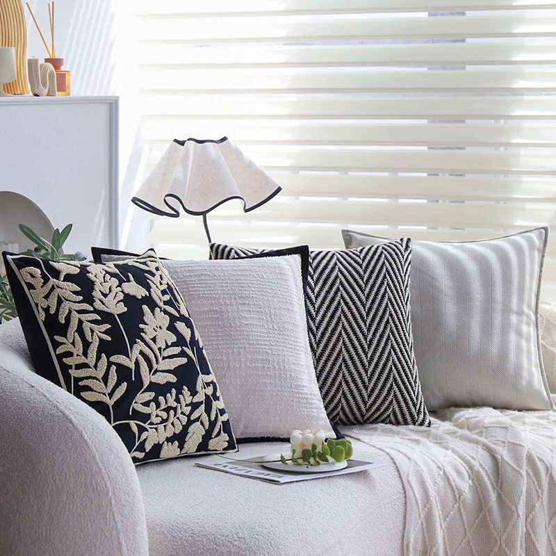 Square cushion cover with subtle herringbone texture and surrounding piping seam Stornfield