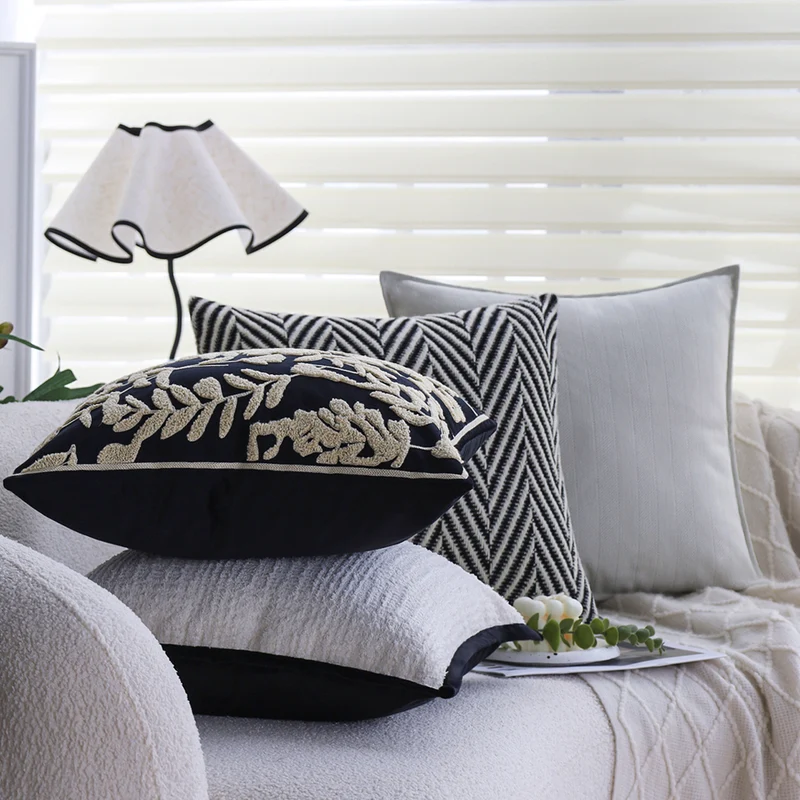 Square cushion cover with subtle herringbone texture and surrounding piping seam Stornfield
