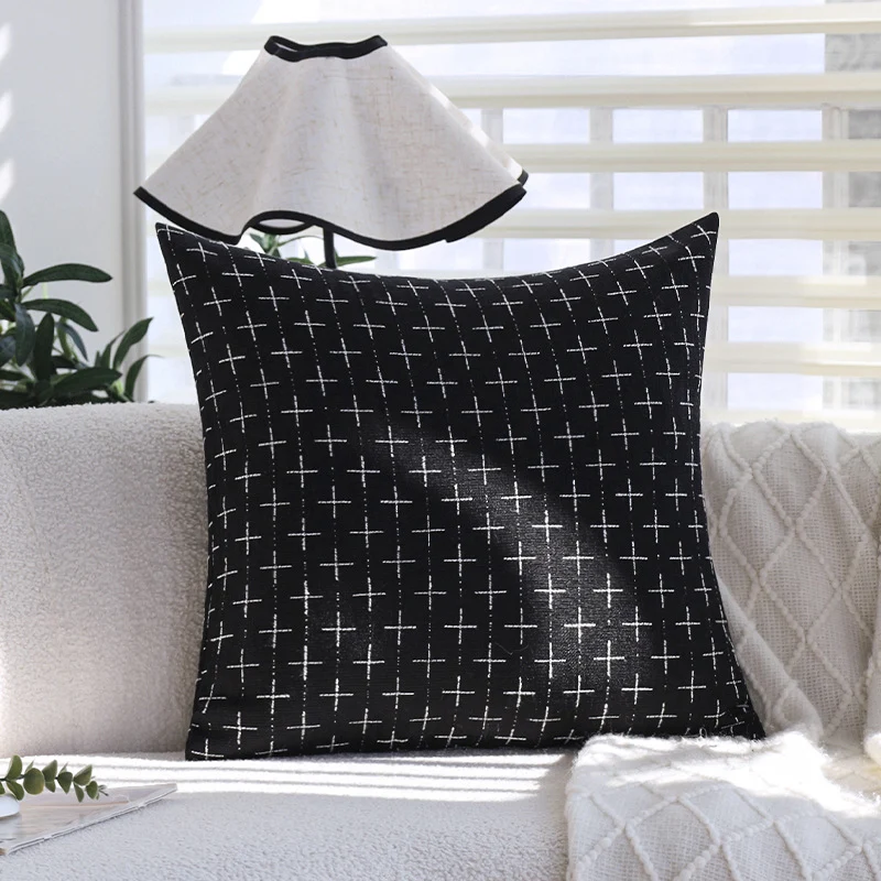 Square cushion cover in Scandinavian minimal style with woven cross pattern and natural linen look Stornfield