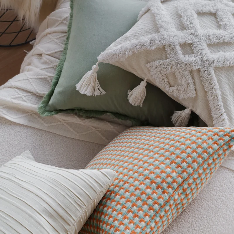 Square cushion cover in boho style with 3D tufting, tassels and soft cotton texture Stornfield