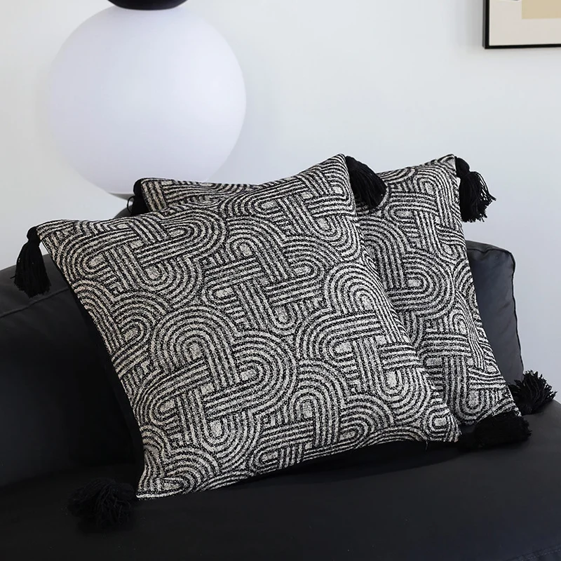 Square cushion cover made of textured bouclé weaving with geometric relief and corner tassels Stornfield