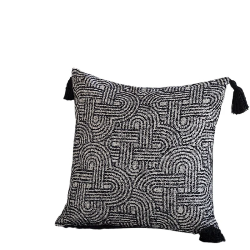 Square cushion cover made of textured bouclé weaving with geometric relief and corner tassels Stornfield