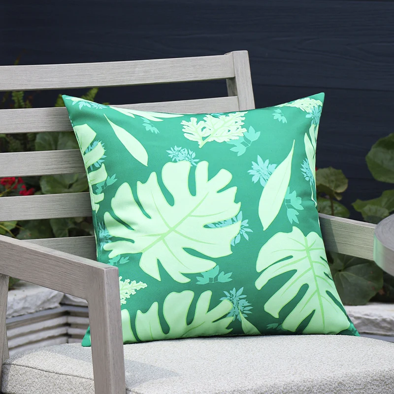 Square outdoor cushion cover made of water-repellent polyester with tropical Monstera print Stornfield