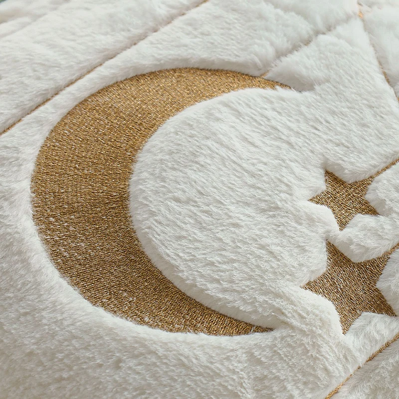 Square faux fur cushion cover with gold embroidered moon and star design and soft inner lining Stornfield