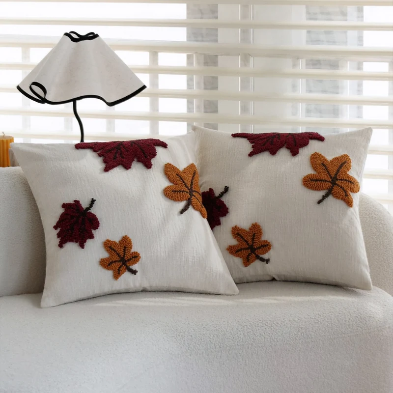 Square cushion cover with hand-tufted autumn leaf appliqués Stornfield